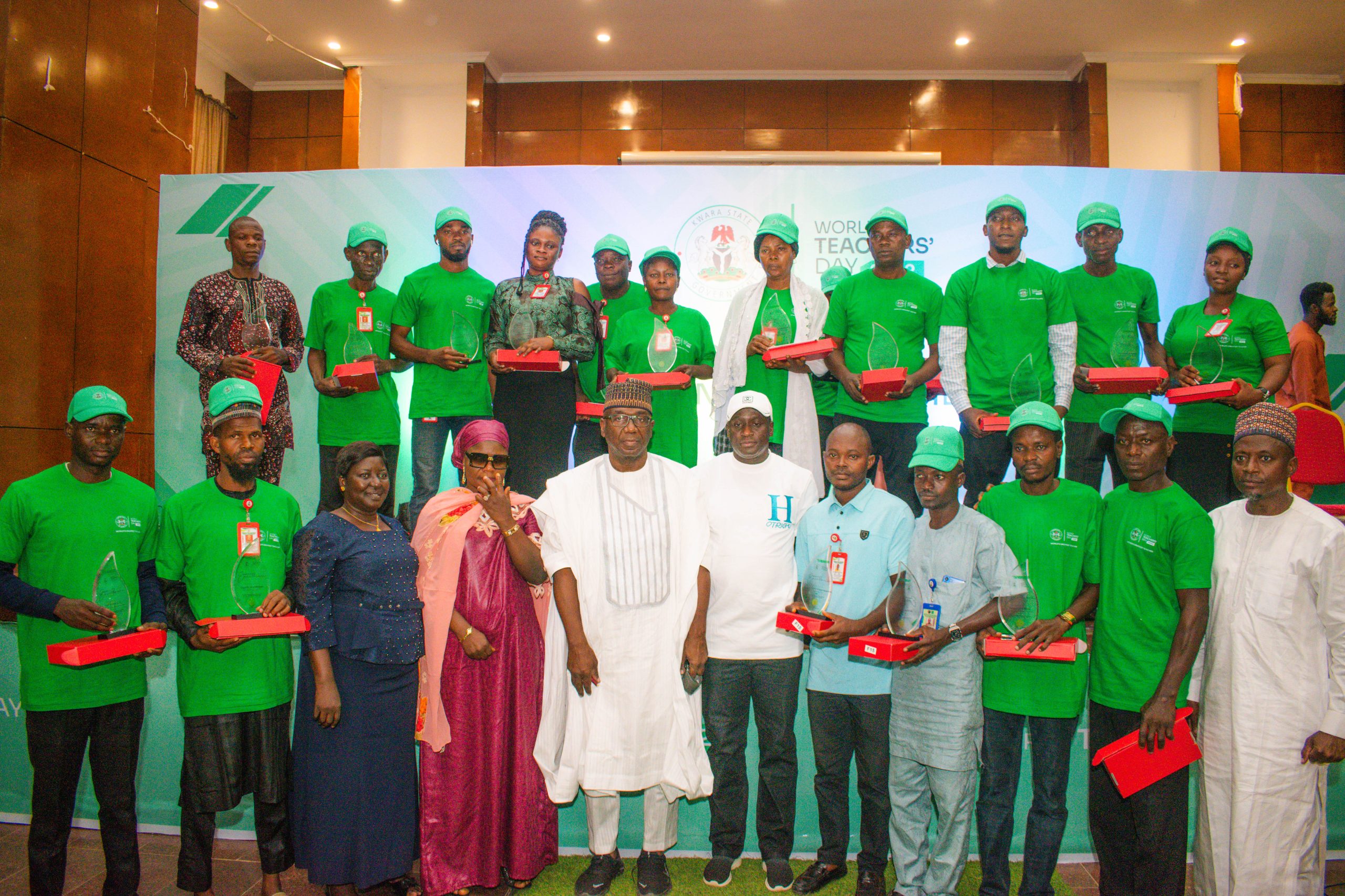 Governor AbdulRahman AbdulRazaq of Kwara State standing with a group of teachers who were honored for their outstanding contributions to the teaching profession.