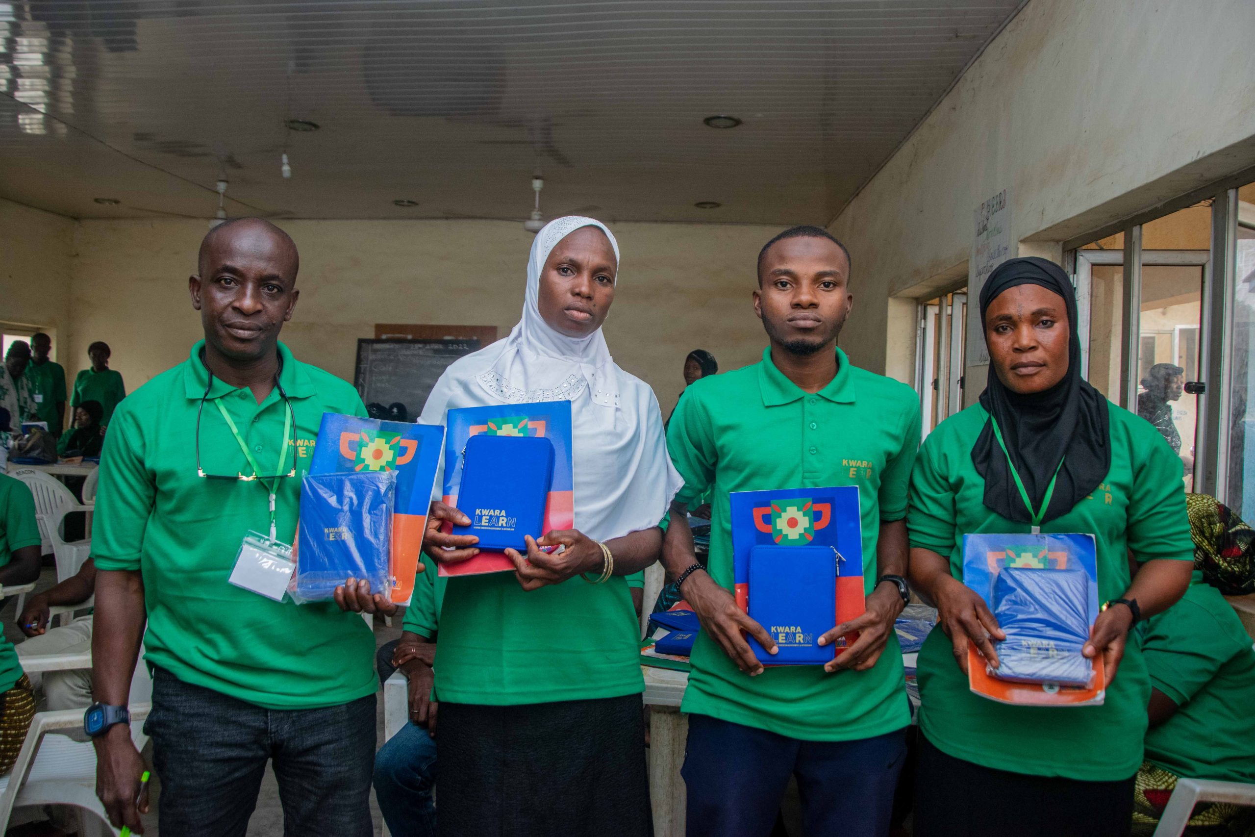 Some newly inducted KwaraLEARN teachers holding their teacher tablets.